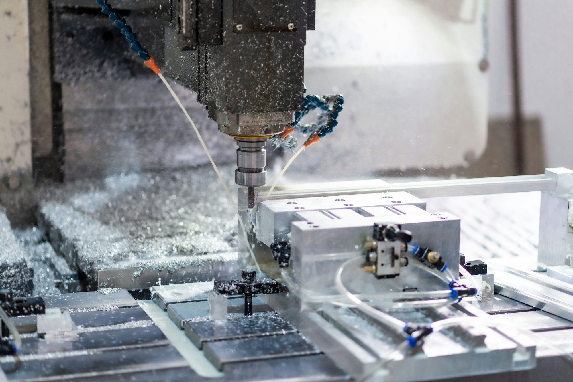 A machine that is cutting a piece of metal